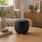 Stadler Form Mia aroma diffuser zwart met zichtbare nevel en bedieningsknoppen