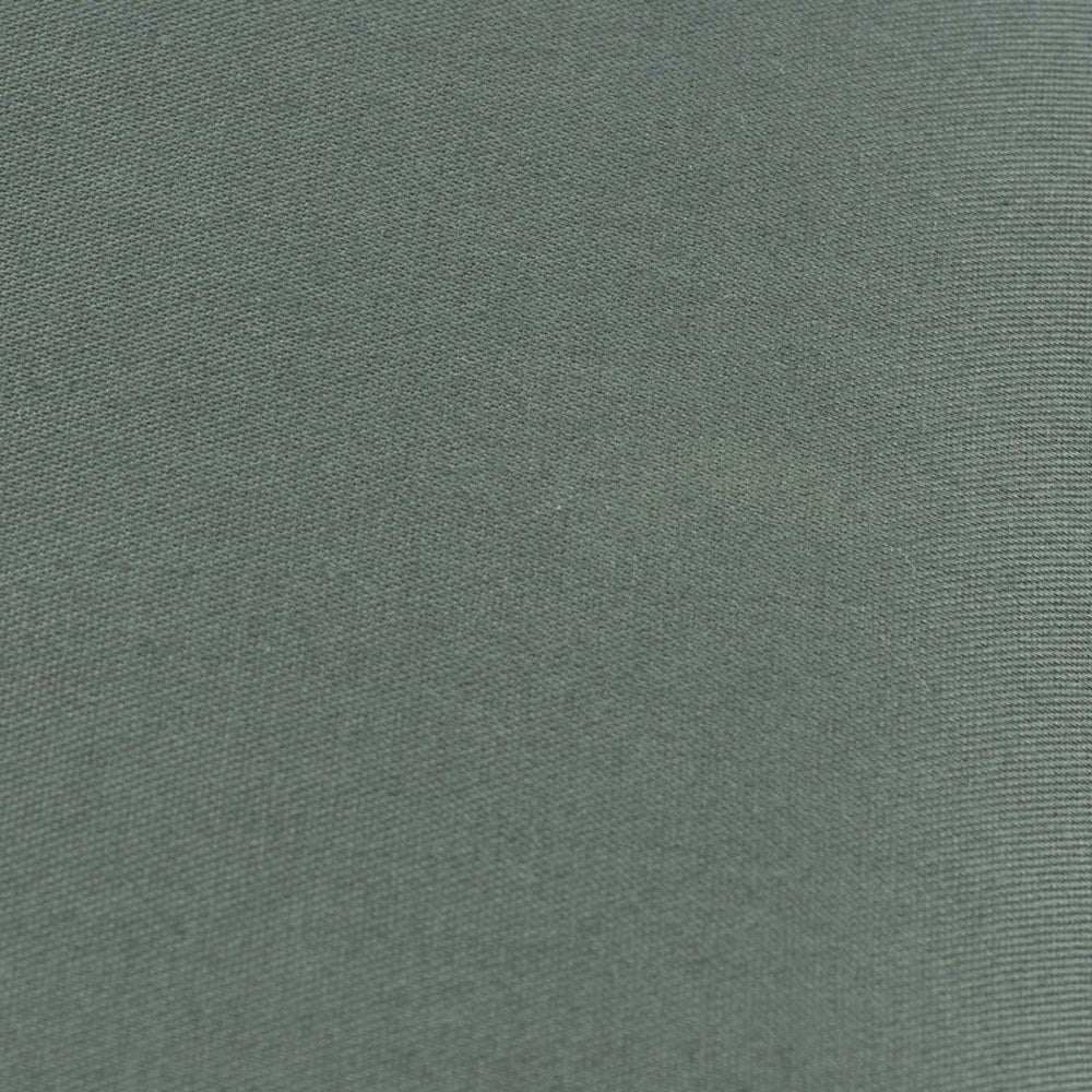 Grijs-groen katoenen dekbedovertrek close-up matte textuur