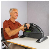 Tunturi Cardio Fit M35 Minibike gebruikt aan bureau met handgrepen