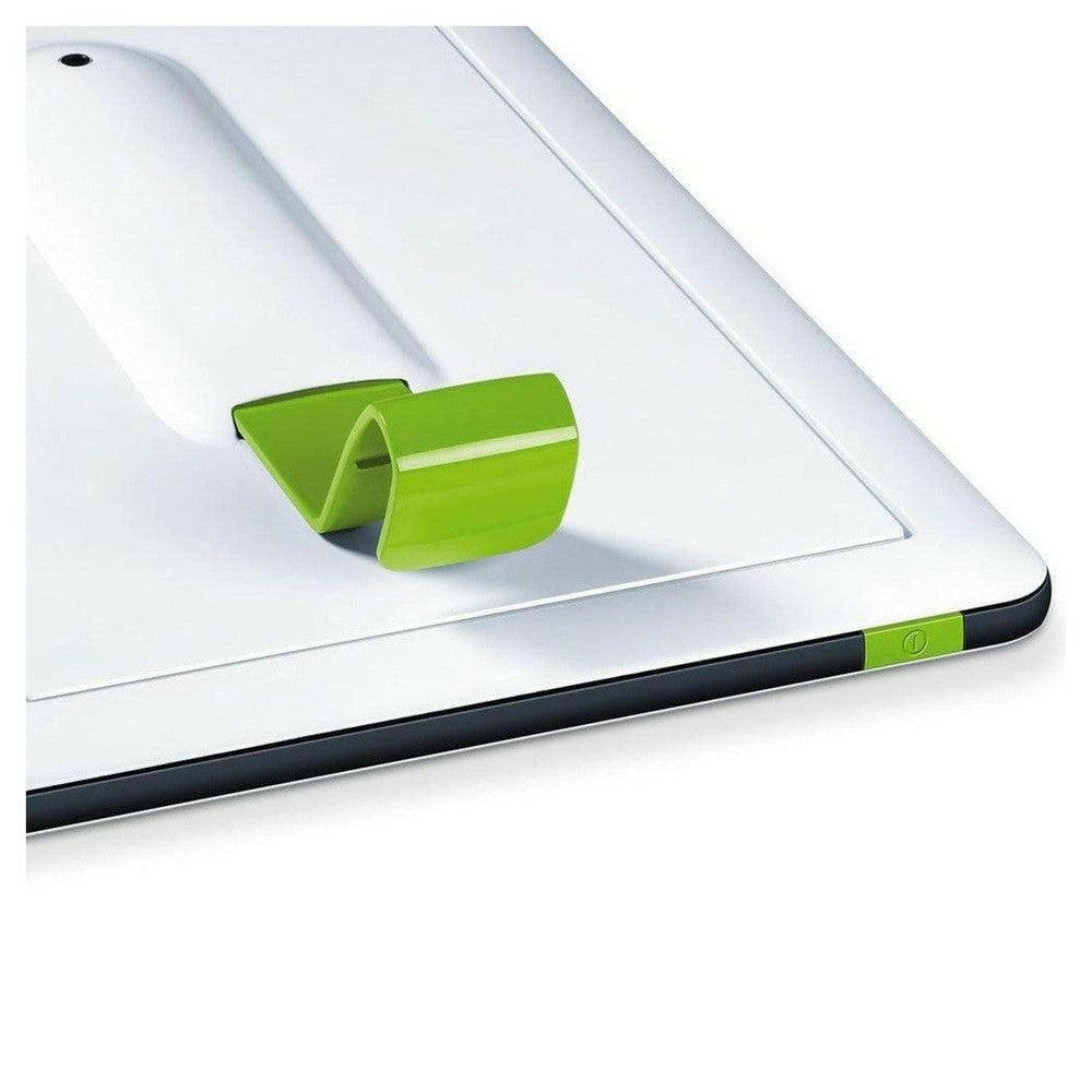 Close-up Beurer TL30 daglichtlamp met groen bedieningsknopje en glad wit oppervlak