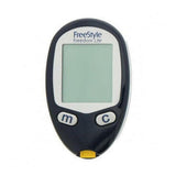 Zwarte FreeStyle Freedom Lite glucosemeter met lichtgroen display en teststripinvoer