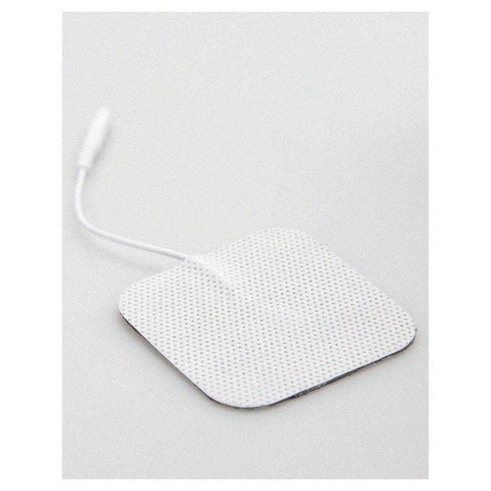 Close-up witte vierkante zelfklevende elektrode met textuurpatroon
