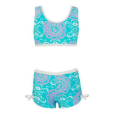Turkooise kinder zwemtop en broek met paarse bloemenpatroon