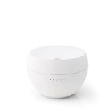 Witte bolvormige Stadler Form Jasmine aroma diffuser met matte afwerking en bedieningsknoppen