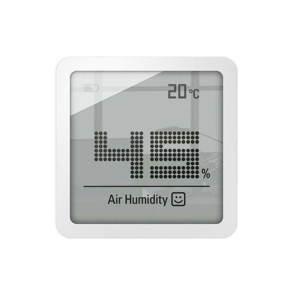 Voorzijde Stadler Form Selina Little hygrometer met glimlachend icoon en temperatuurweergave
