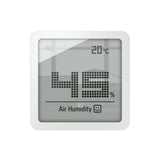 Voorzijde Stadler Form Selina Little hygrometer met glimlachend icoon en temperatuurweergave