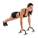 Tunturi opdruksteunen in gebruik voor comfortabele push-ups met ribbeltextuur