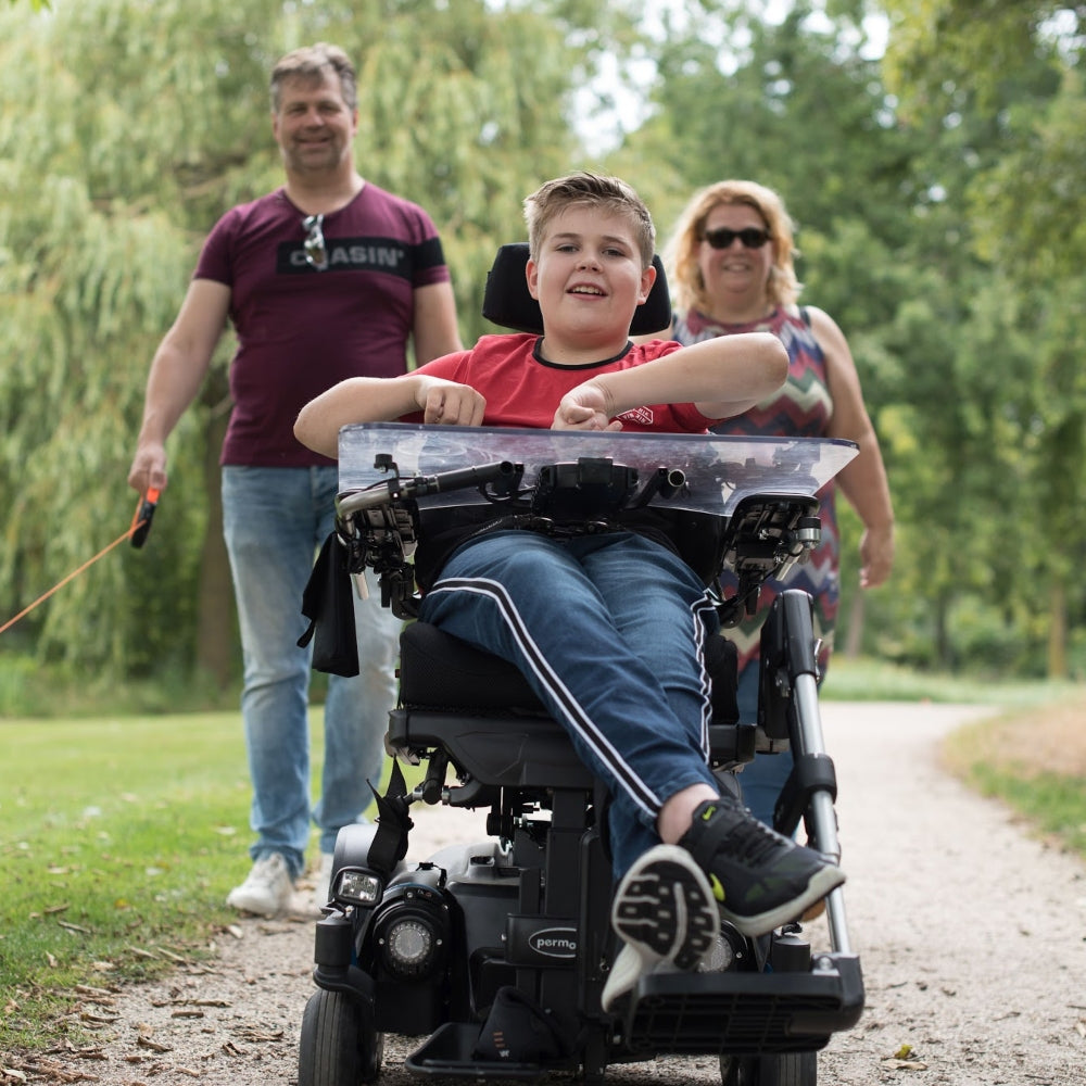 Foto Mantelzorger - wandelen met mijn zoon in elektrische rolstoel in het park