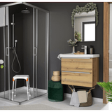 Witte douchekruk in moderne badkamer met glazen cabine