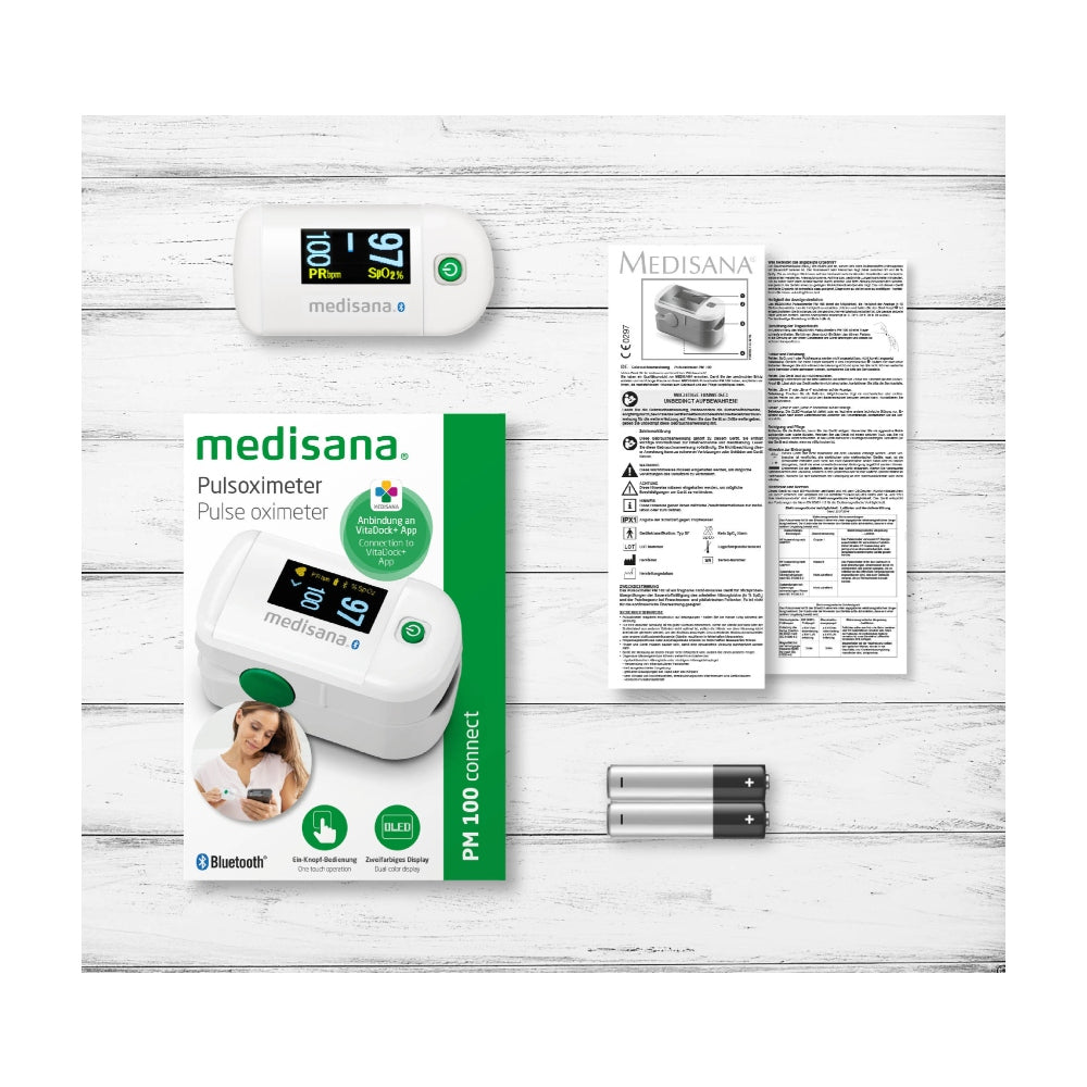 Verpakking inhoud Medisana saturatiemeter inclusief handleiding en batterijen