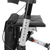 Timago Yola rollator zitting detail: zwart gepolsterd zitkussen en aluminium frame met opbergzak