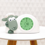 Zazu slaaptrainer groen op houten tafel met groene verlichting