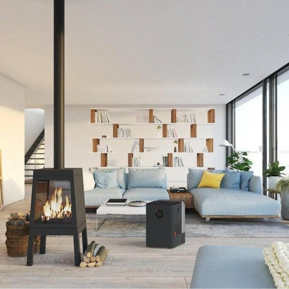 Boneco W300 luchtwasser zwart naast lichtblauwe hoekbank in woonkamer