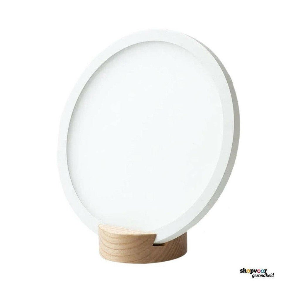 Innolux ronde witte tafellamp voor lichttherapie op witte achtergrond