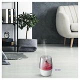 Clean Air Optima AD-302 aroma diffuser in woonkamer met rood licht en stoom
