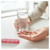 Losse roze Fysic pillendoos vier vakken met dag- en nachticonen voor medicijnen