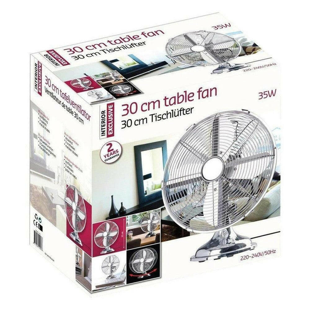 Verpakking van 30 cm zilveren tafelventilator met garantie label