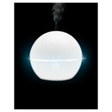 Lanaform Bali aroma diffuser wit met helder blauw licht op donkere achtergrond