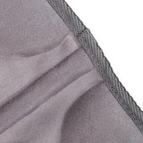 Close-up fluwelen textuur grijze massagekussen rand detail