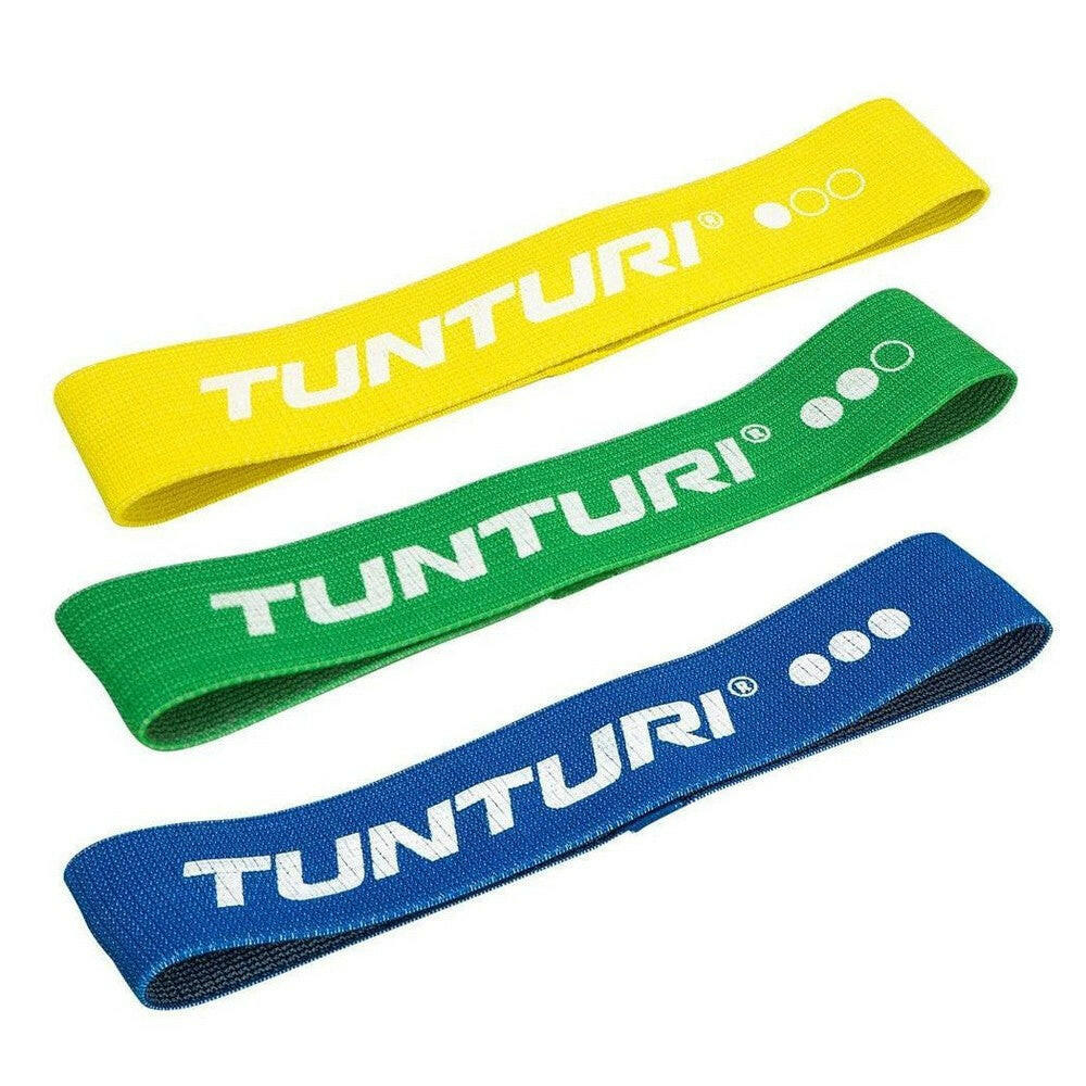 Drie gekleurde Tunturi textiel weerstandsbanden geel groen blauw naast elkaar